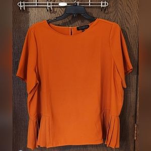 Orange Eloquii short sleeve blouse with pleats